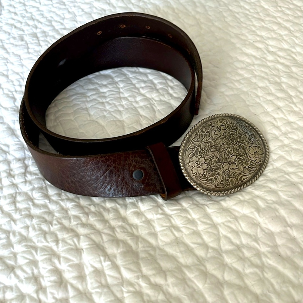 Silver buckle engraved, leather belt.
